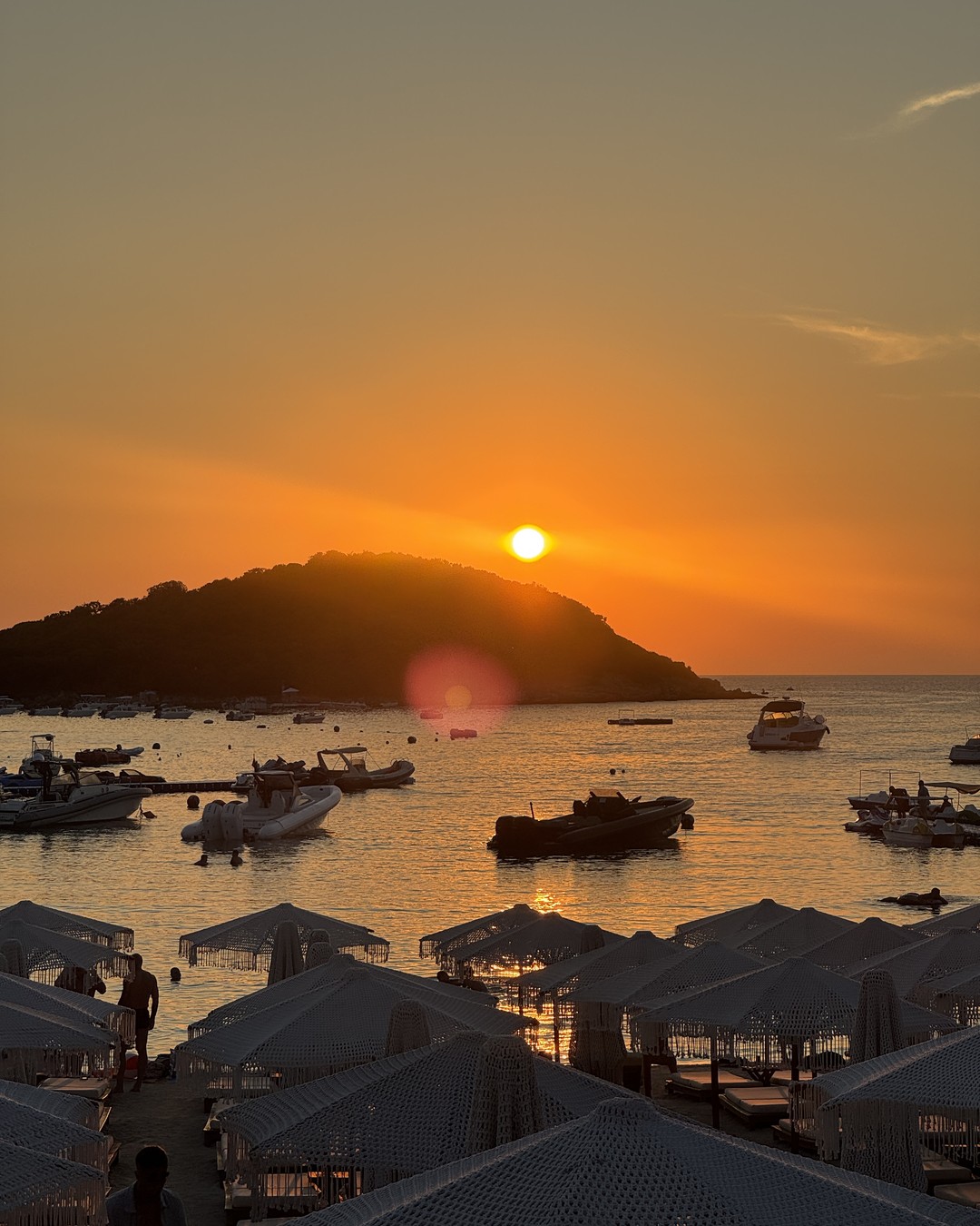 Sunset over the islands seen from a restaurant terrace in Ksamil, Albania