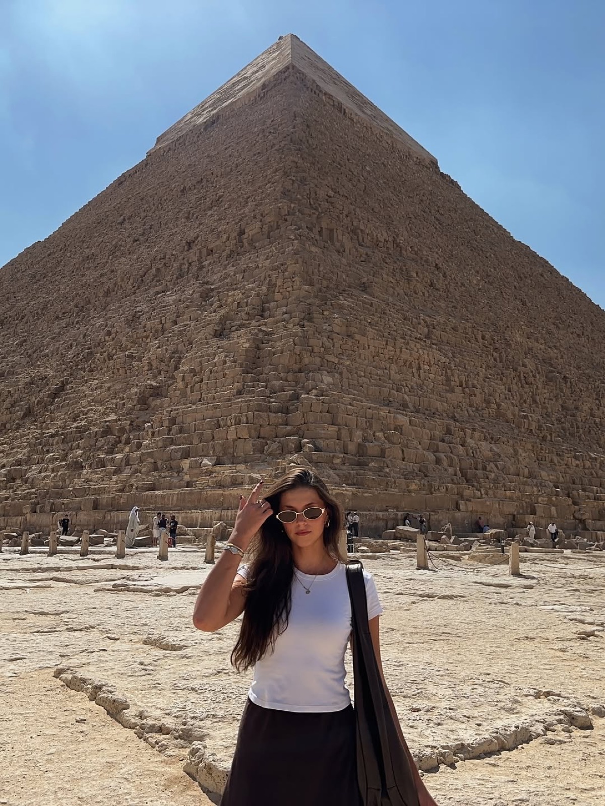 Ellen standing at the base of the Great Pyramid of Giza