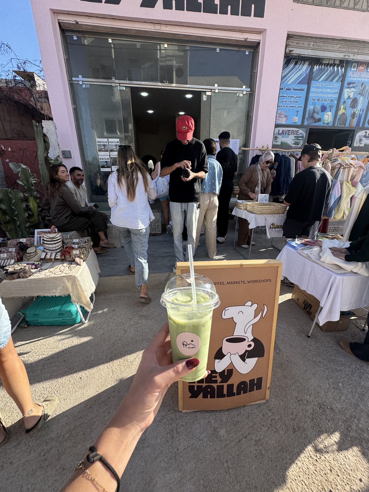 Matcha in front of market stalls at Hey Yallah café in Tamraght, Morocco
