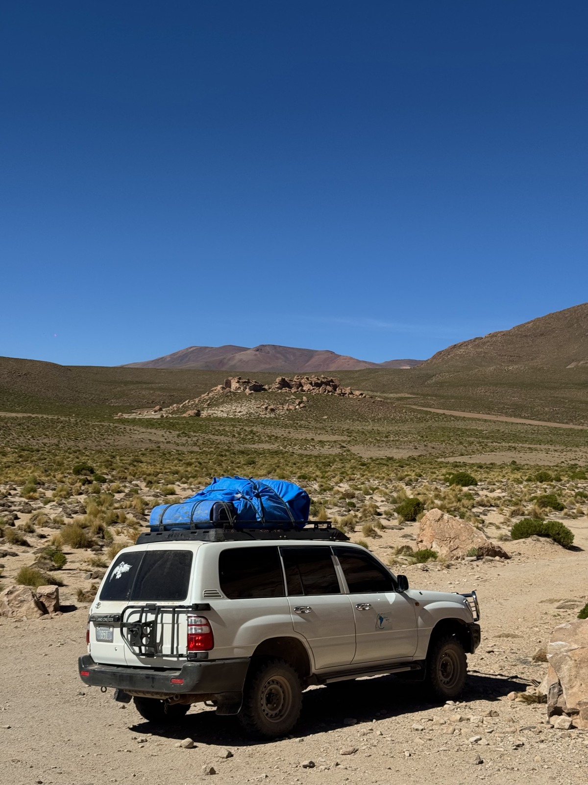 Our four-wheel drive with luggage strapped to the roof during the Bolivia crossing