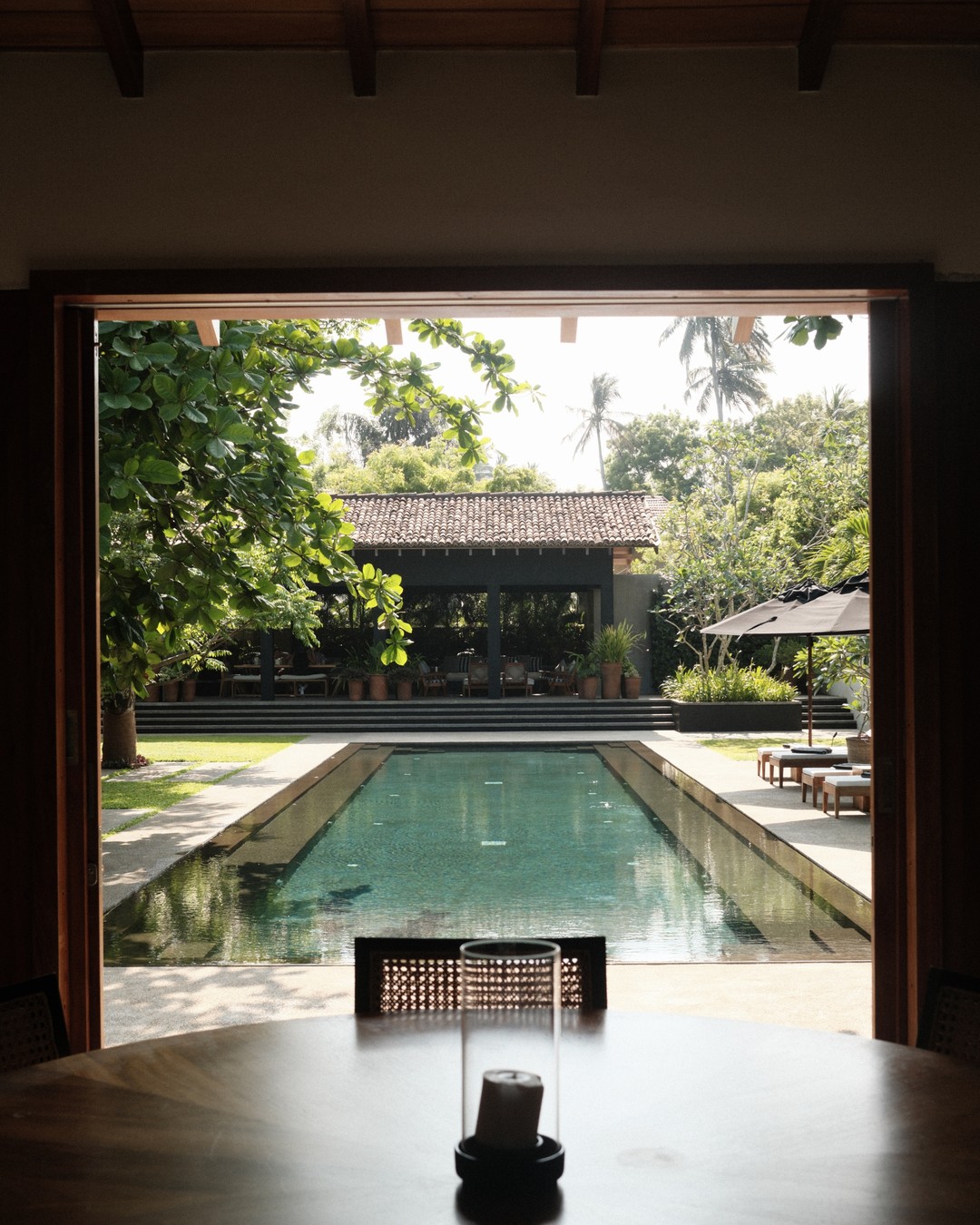 Long lap pool seen through an open pavilion at a villa near Tangalle, Sri Lanka